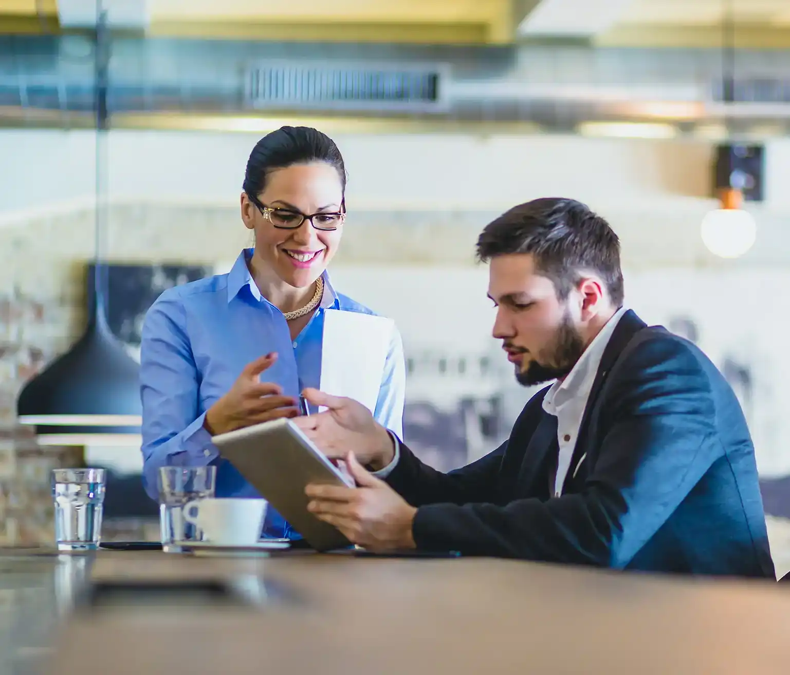 Woman and man talking business at restaurant